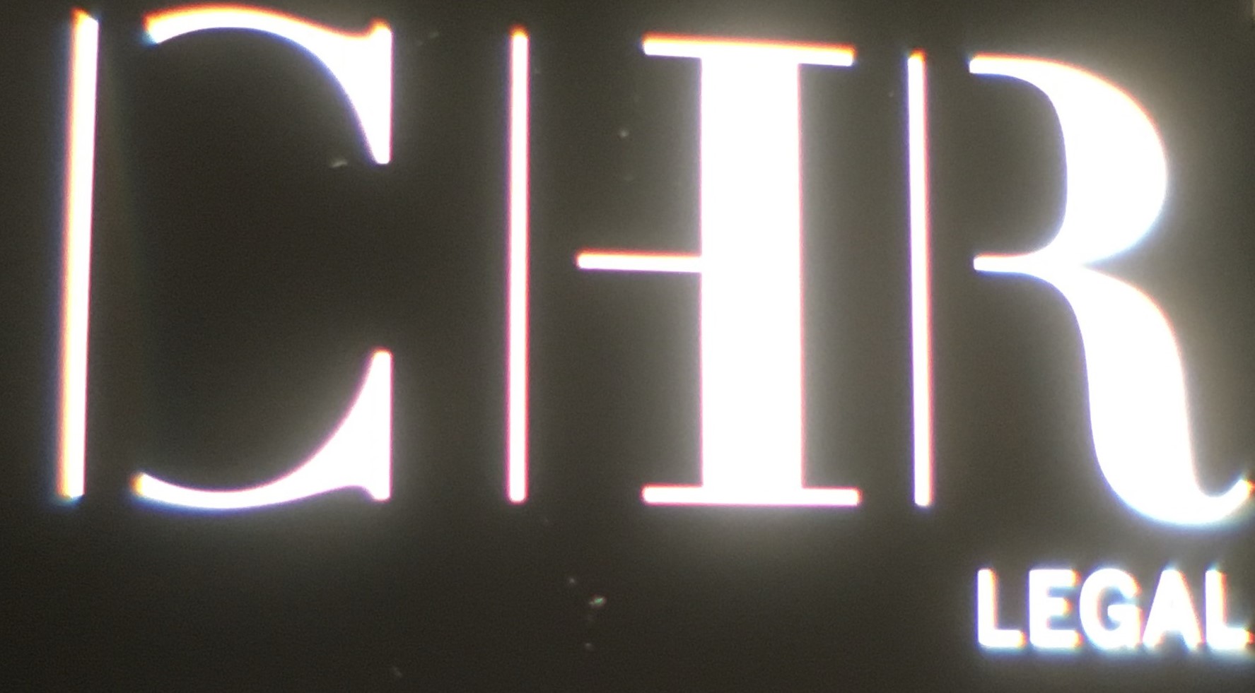 Legal sign with initials "CHR" and the word "LEGAL" displayed prominently.