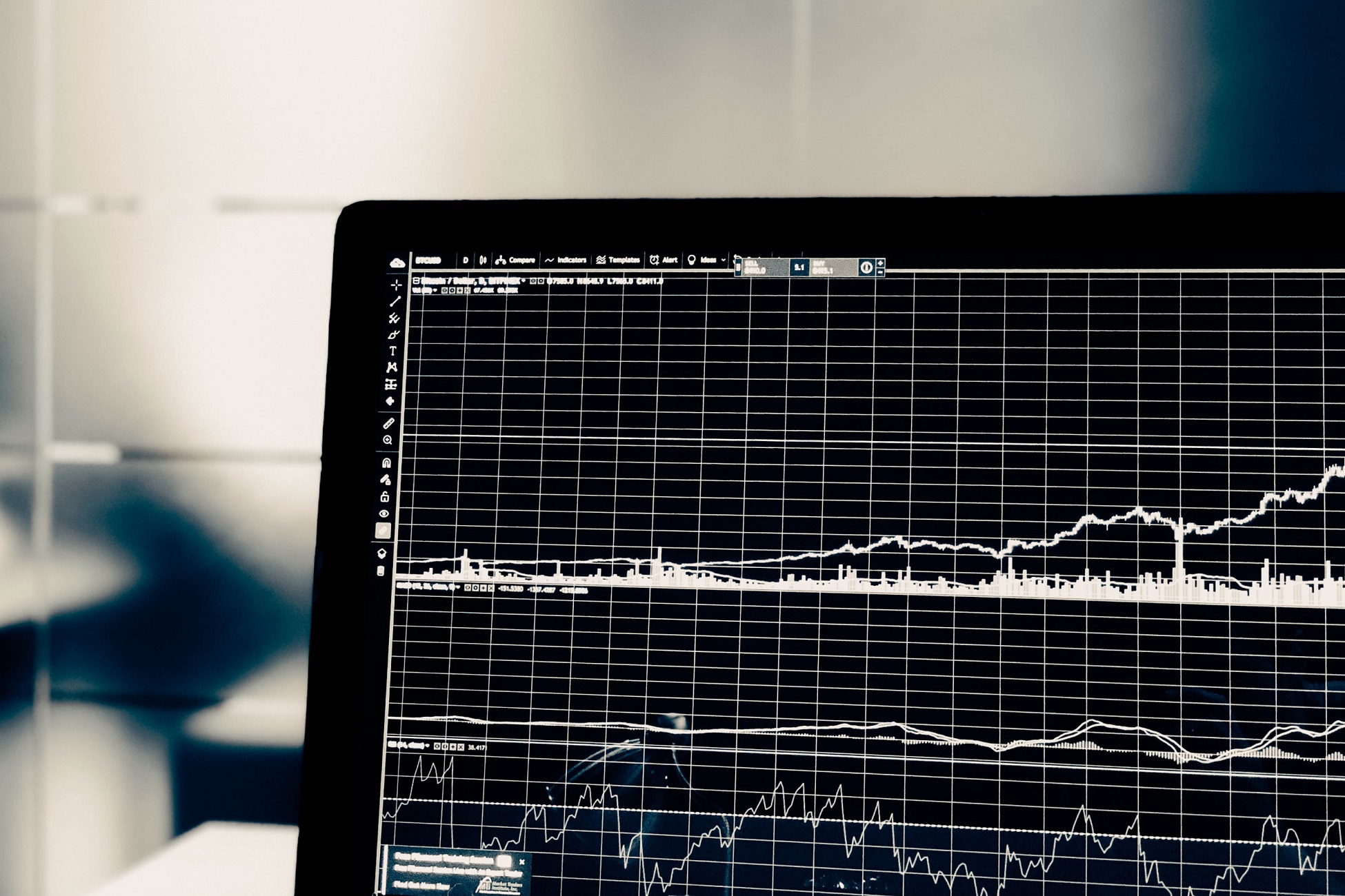 Data analysis graph displayed on a laptop screen with financial metrics and stock trends.