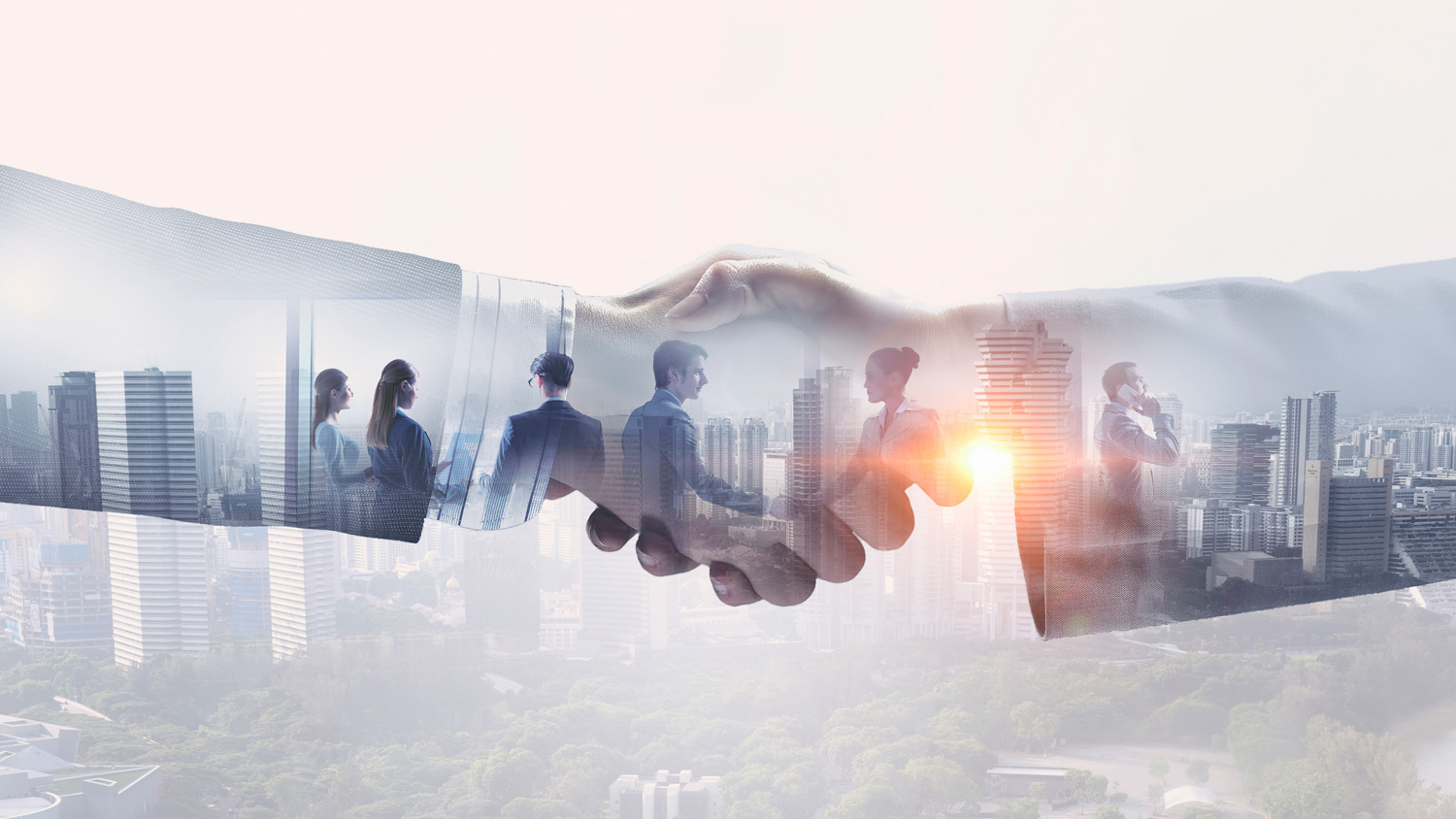 Business professionals shaking hands with a city skyline in the background, symbolizing partnership and collaboration.