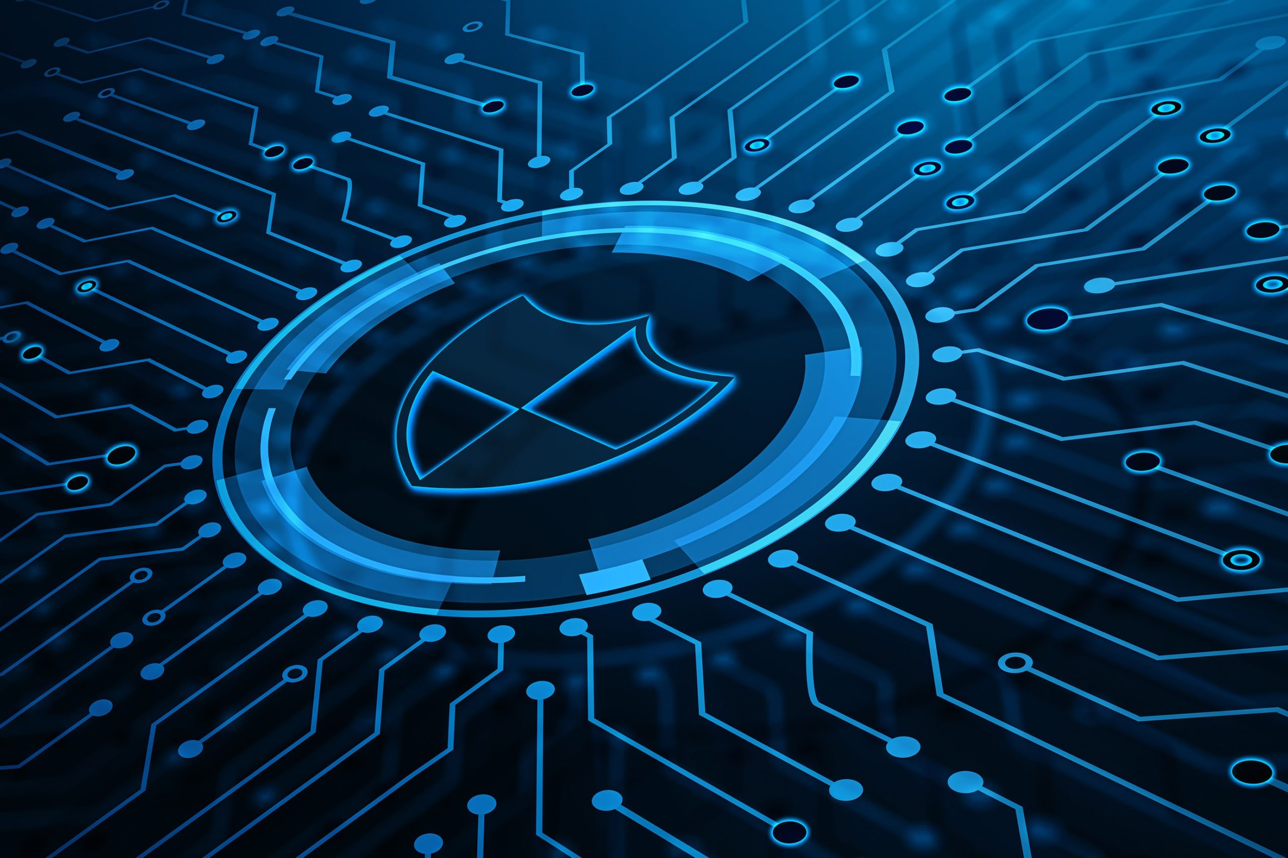 Digital illustration of a shield symbol overlaid on intricate circuit patterns, representing cybersecurity concepts.