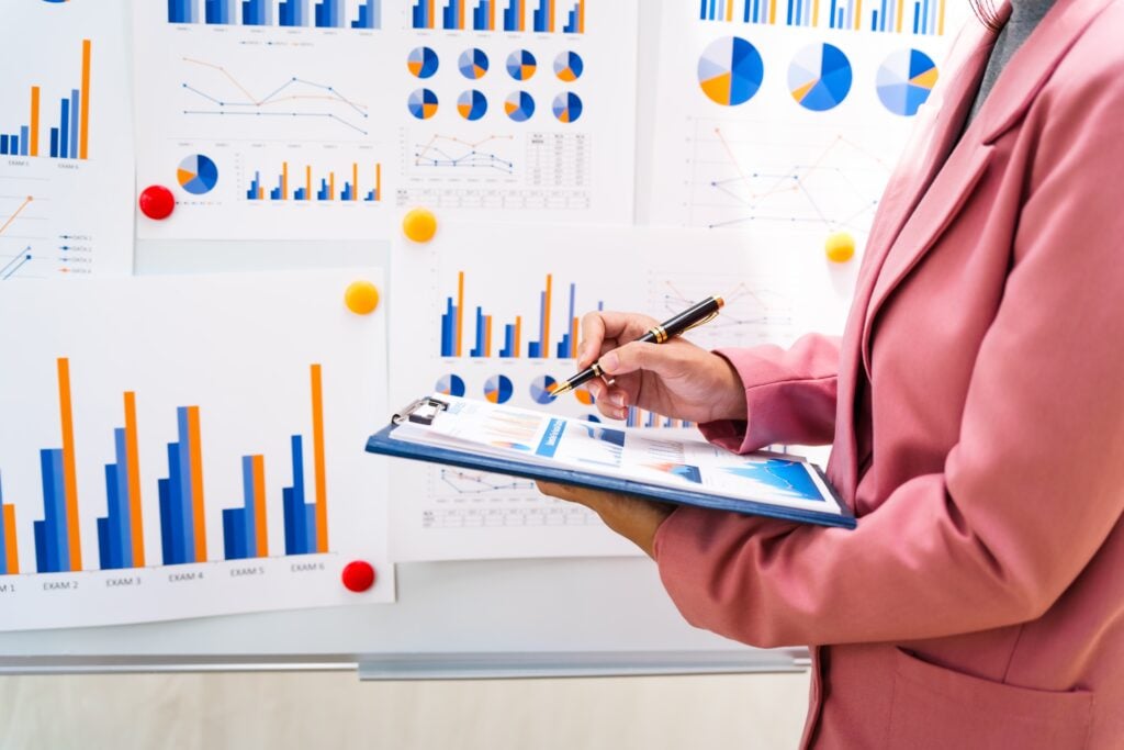 Home - A Businesswoman In A Pink Suit Works At A Desk Wit 2024 07 15 23 07 28 Utc Min 1 - Global Law Experts