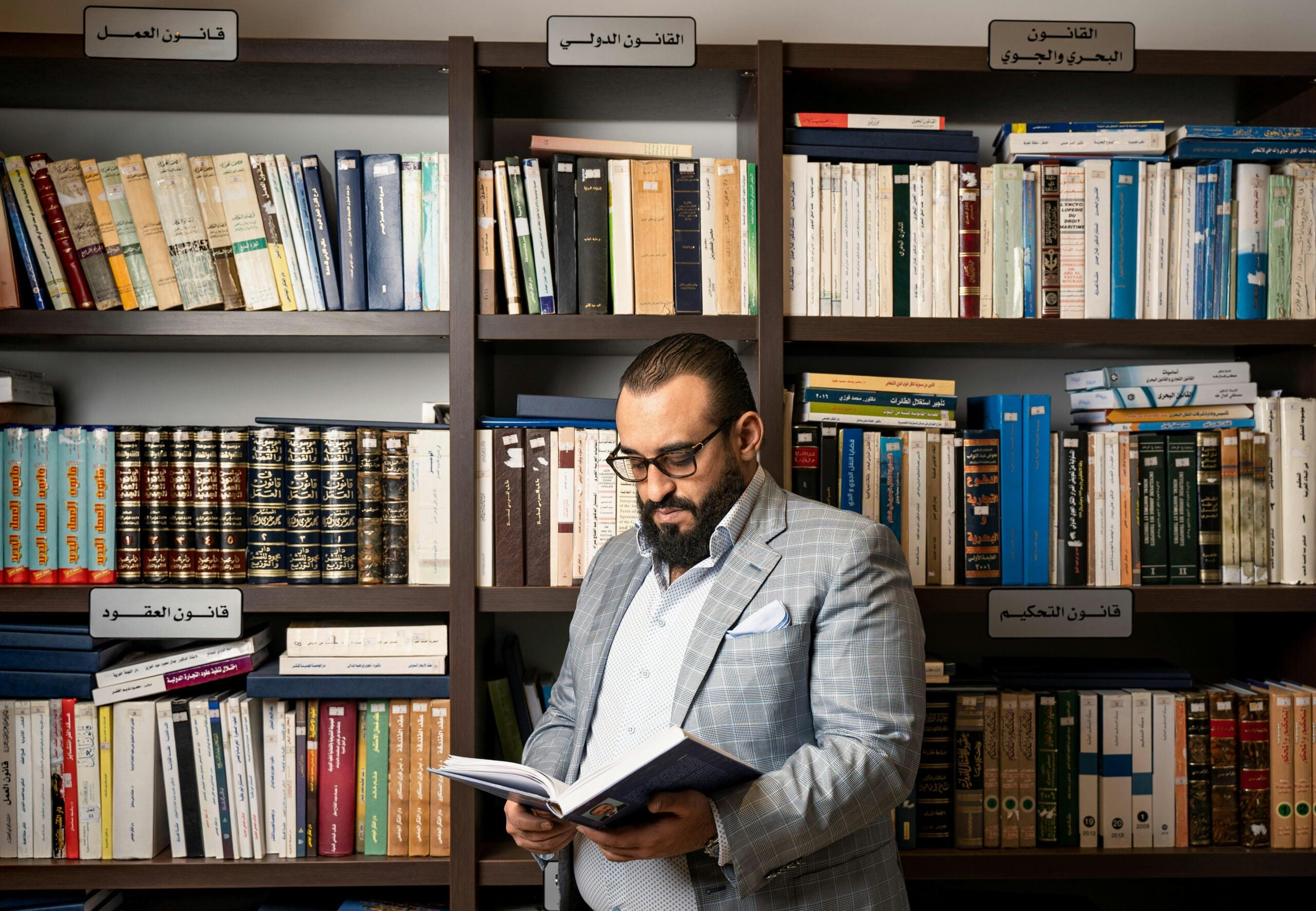 Understanding Different Legal Systems (books with man reading) | GLE News