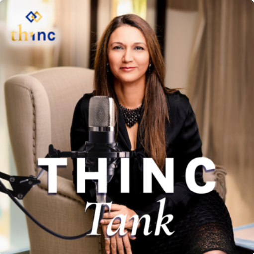 Professional woman seated in armchair with microphone, promoting legal discussions in a podcast setting.