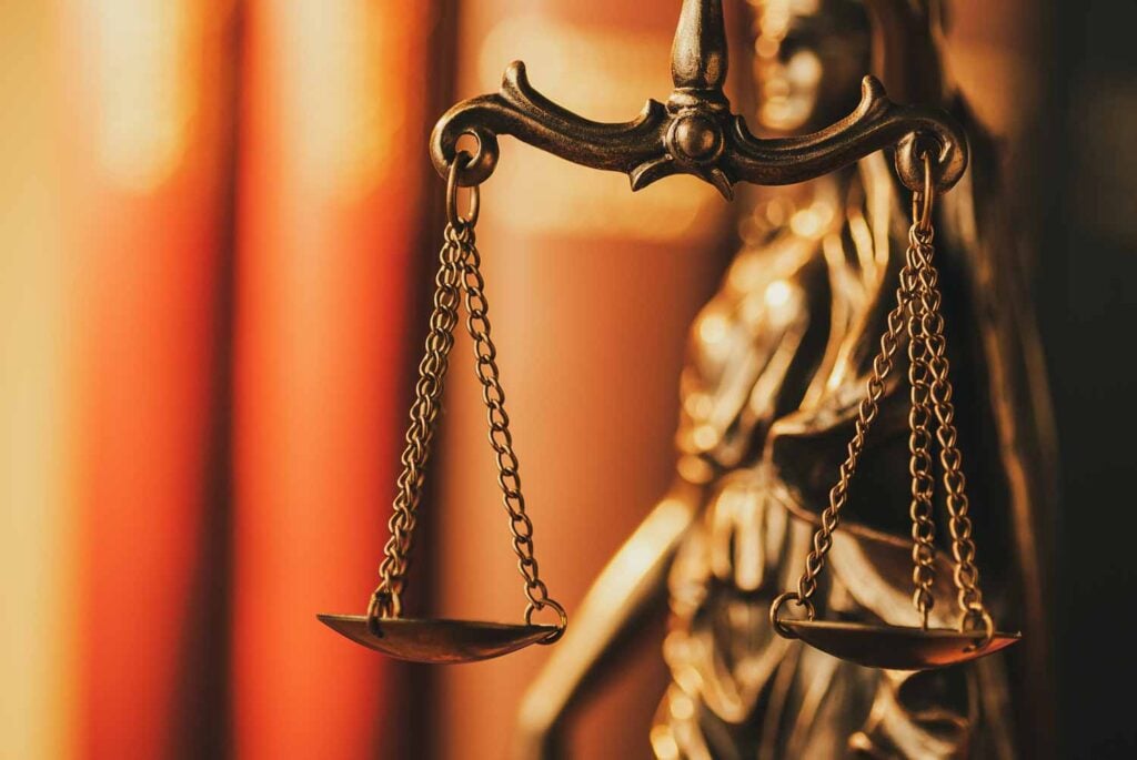 Home - Brass Scales Of Justice In A Close Up View - Global Law Experts