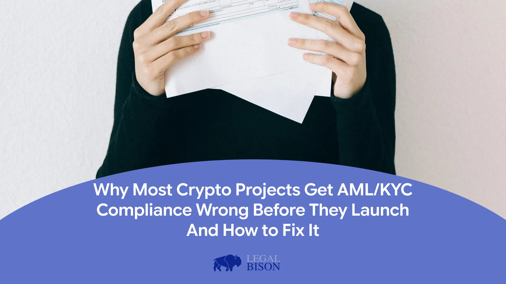 Person holding documents related to compliance, with a focus on cryptocurrency regulations and legal guidance.
