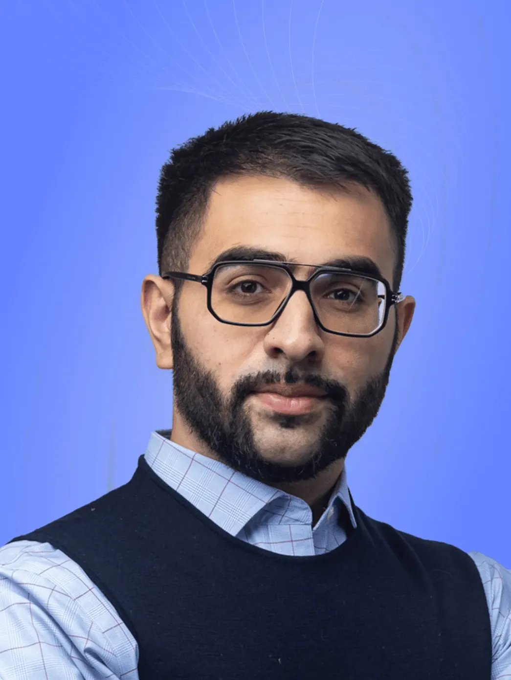 Legal professional posing with a neutral expression against a blue background.