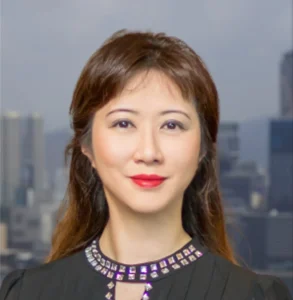 Professional woman with a confident expression, set against a city skyline background.